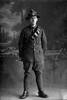Full length portrait of Gunner Eric Gordon Sherson, Reg No 17229, of the New Zealand Field Artillery. (Photographer: Herman Schmidt, 1916). Sir George Grey Special Collections, Auckland Libraries, 31-S2151. No known copyright.