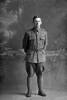 Full length portrait of Private (Lance Corporal in the Nominal Roll) John Finlay Seaton, Reg No 40647, of the Auckland Infantry Regiment, - A Company, 23rd Reinforcements. Killed in action in France on 4 October 1917 at the Battle of Passchendaele. (Photographer: Herman Schmidt, 1917). Sir George Grey Special Collections, Auckland Libraries, 31-S2501. No known copyright.