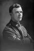 1/4 portrait of Corporal Sinel, probably Wilfred Courtney Sinel. (Photographer: Herman Schmidt, 1917). Sir George Grey Special Collections, Auckland Libraries, 31-S2512. No known copyright.