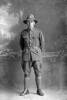 Full length portrait of Private William Gordon Simpkin, Reg No 33620, of the Auckland Infantry Battalion, - A Company, 21st Reinforcements (Photographer: Herman Schmidt, 1917). Sir George Grey Special Collections, Auckland Libraries, 31-S2514. No known copyright.