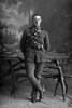 Full length portrait of Trooper John Troup, Reg No13/467, of the 4th (Waikato) Mounted Rifles, Auckland Mounted Rifles, New Zealand Mounted Rifles, Main Body. (Photographer: Herman Schmidt, 1914). Sir George Grey Special Collections, Auckland Libraries, 31-T1230. No known copyright.