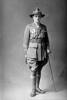 Full length portrait of Lieutenant R Tilsley of the 6th (Hauraki) Regiment, Auckland Infantry Regiment, with service chevrons and the Distinguished Conduct Medal and the Military Cross. (Photographer: Herman Schmidt, 1918|1919). Sir George Grey Special Collections, Auckland Libraries, 31-T4716. No known copyright.
