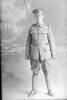 Full length portrait of Rifleman A E Warner of the 3rd Battalion, New Zealand Rifle Brigade. Probably Rifleman Ernest Aldred Warner, Reg No 25/1145, - D Company. (Photographer: Herman Schmidt, 1916). Sir George Grey Special Collections, Auckland Libraries, 31-W1276. No known copyright.