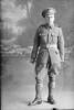 Full length portrait of Rifleman Lewis Albert Warren, Reg No 26/936, a scout with the 4th Battalion, New Zealand Rifle Brigade. Later a Lance Corporal, killed in action in France on 7 June 1917 at the Battle of Messines. (Photographer: Herman Schmidt, 1916). Sir George Grey Special Collections, Auckland Libraries, 31-W1279. No known copyright.