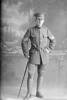 Full length portrait of Quartermaster Sergeant Edward Randal Woledge of the Divisional Headquarters Staff. (Photographer: Herman Schmidt, 1916). Sir George Grey Special Collections, Auckland Libraries, 31-W1395. No known copyright.