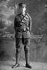 Full length portrait of either Trooper Albert Sydney Wyllie, Reg No 13/2631, or his brother Herbert Wills Wyllie, Reg No 13/2632, both of the 3rd (Auckland) Mounted Rifles, Auckland Mounted Rifles, New Zealand Mounted Rifles, 8th Reinforcements. (Photographer: Herman Schmidt, 1915). Sir George Grey Special Collections, Auckland Libraries, 31-W1783. No known copyright.