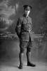 Full length portrait of Corporal Weston of the 20th Reinforcements, - A Company. Possibly (Sergeant in the nominal roll) Raymond Charles Geddis Weston, Reg No 34463, of the 20th Reinforcements, - E Company. (Photographer: Herman Schmidt, 1916). Sir George Grey Special Collections, Auckland Libraries, 31-W2581. No known copyright.