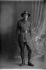 Full length portrait of Trooper Henry Fenton Waugh, Reg No 71830, of the New Zealand Mounted Rifles, 37th Reinforcements. (Photographer: Herman Schmidt, 1917). Sir George Grey Special Collections, Auckland Libraries, 31-W3967. No known copyright.