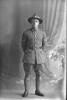 Full length portrait of Lance Corporal (Corporal in the nominal roll) William Leonard Wyber, Reg No 70584, of the 35th Reinforcements, - A Company. (Photographer: Herman Schmidt, ). Sir George Grey Special Collections, Auckland Libraries, 31-W4813. No known copyright.