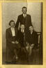 Portrait of 13/2029 Thomas Cowley, family portrait December 1941 with wife Soph, sons Trevor and Ivan (per caption). This image may be subject to copyright.