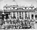 Informal group photo of 22 soldiers standing outside St Peters, Rome in 1944, including Darcy Gardiner, s/n 800706 standing at centre of soldiers in the back row. (Collection of Darcy Gardiner (800706)) . Image provided by Brian Gardiner. This image may be subject to copyright.