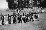 9 members of the Bren Carrier platoon practising shooting their rifles at camp. (Collection of Darcy Gardiner (800706)). Image provided by Brian Gardiner. This image may be subject to copyright.