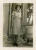 Portrait, Mary Bernadette Stapleton (married name Crispin) s/n 72052 standing outside next to columns large garden urn. Photograph annotated on reverse "in Alexandria, Egypt, 15th August 1943". No Known Copyright.