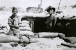 William Sharp (s/n 34491) (left), and another man in front of a sand-bagged dugout. Image provided by family. This image may be subject to copyright.
