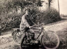 Photograph of R H P Ronayne (4/1226) sitting on a motorbike. Image provided by Moira Brabazon. Image has no known copyright restrictions.