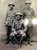 Photograph of R H P Ronayne (4/1226) sitting, along with two other unknown men. Image provided by Moira Brabazon. Image has no known copyright restrictions.