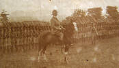 On horseback, Edmund Graham Baskett with the Nigerian troop, photo from his personal album. Image kindly provided by Sally Chao April 2016. Image has no known copyright restrictions.