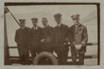 Unknown, photographer (1917). A few of us before church parade at Cape Town.  W. Simpitlaw 3rd engineer, F. Howell 5th engineer, R Needham 2nd mate, Alfred George Neall 1st Ref, P. Erson 2nd Ref. Auckland War Memorial Museum - Tamaki Paenga Hira. PH-ALB-461-p8-1. Image has no known copyright restrictions.