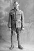 Full length portrait of Private Jack Ravlich, Reg No 12/3790 (Photographer: Herman Schmidt, 1916). Sir George Grey Special Collections, A, of the Canterbury Infantry Battalion, 8th Reinforcements. (Photographer: Herman Schmidt, 1916). Sir George Grey Special Collections, Auckland Libraries. No known copyright restriction.