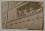 Unknown, photographer (ca.1917). Watching the boxing (?) from the town bridge. Captain Hayter, Capt. Moore (Doc) Lt. Fairbrother and "Sparks" (?) Auckland War Memorial Museum - Tamaki Paenga Hira. PH-ALB-461-p13-2. Image has no known copyright restrictions.