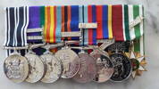 Photograph of Brigadier Edward Bestic X38270 medals'. Image Kindly provided by Edward Bestic. Image subject to copyright restrictions. Medals from Left: New Zealand Operational Service Medal, General Service Medal with Borneo and Malay Peninsula Clasps, Vietnam Medal, The New Zealand General Service Medal (1992) Warlike with Vietnam Clasp, New Zealand Long Service and Good Conduct Medal with bar, Pingat Jasa Malaysia Medal, Canadian General Service Medal - South West Asia for services in Afghanistan, South Vietnamese Medal 1960 Clasp.