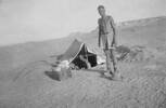 Photograph of Private Philip (Phil) Kent (in tent) with 'Olly Milne' (possibly Allardyce Adam Milne), Western Desert, c.Second World War. From the collection of Arthur William (Moss) Squire 16770, 23 Battalion. Image kindly provided by Roger Sommerville (August 2019). Image may be subject to copyright copyright restrictions.