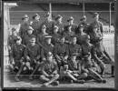 Officers of the Canterbury Mounted Rifles at Addington Camp, Christchurch, August 1914. Back row: Lieutenants L Chaytor, Taylor, Barker, W Deans, F Gorton, Hayter, D S Murchison. Second row: Lieutenant Marchant, Captain Talbot, Lieutenant Blackett, Captain Hurst, Captain Hammond, Lieutenant Free, Lieutenant Bruce. Sitting: Major Wain (O.C. 8th Sqd.), Captain Cody (Q.M.), Major Overton (2nd in Command), Lieutenant-Colonel Findlay (C.O.), Captain Blair (Adjutant), Major Acton-Adams (O.C. 1st Sqd.), Major Hutton (O.C. 10th Sqd.). Front row: Lieutenant Gibbs (Signalling Officer), Tommy the mascot, Lieutenant Davison (Machine Gun Officer), Lieutenant G Dailey. Publication note - Published in "The History of the Canterbury Mounted Rifles 1914-1919" edited by C G Powles, 1928 Quantity: 1 b&w original photographic print(s). Physical Description: Silver gelatin print 15.5 x 20.4 cm. Officers of the Canterbury Mounted Rifles, Addington Camp, Christchurch. Powles family :Photographs. Ref: PAColl-5268-2-01. Alexander Turnbull Library, Wellington, New Zealand. /records/22690564
