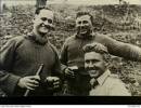 Photograph of 'Three officers from 'A' Company, 3rd Battalion, The Royal Australian Regiment (3RAR), share a bottle of beer in a reserve area. The soldiers are (left to right): Captain Brian Poananga, a New Zealander serving with the battalion; 3/40105 Lieutenant Gilmer John (Gil) Lucas MC; 3/395 Major Jeffrey James (Jim) Shelton MC, the company commander.' Australian War Memorial, P02208.035. Image may be subject to copyright restrictions.