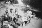 Photograph of Thomas Alfred Mann 13740, James (Jim) Hennessy, James (Jim) Slaven and Major Alfred Carswell Marett 13740 at lunch near Tripoli. From the collection of Arthur William (Moss) Squire 16770, 23 Battalion. Image kindly provided by Roger Sommerville (December 2019). Image may be subject to copyright restrictions.