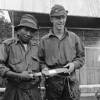 Photograph of Uda with Lieutenant Ian Hamilton Burrows, Malaya, c.1955. Taken by an unknown New Zealand Army photographer. Alexander Turnbull Library, Wellington, M-0766-F. Image is subject to copyright restrictions.