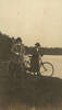 Photograph of Nurse Margaret Nixon and Nurse Eleanor Gould with bikes on the banks of the river. From Nurse Gould's Photo album. Image kindly provided by National Army Museum 1986.1753. Image may be subject to copyright restrictions.