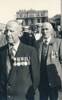 Photograph of Arthur William Judge (front, left)  and unidentified man at an Anzac Day Parade, date unknown. Image courtesy of the Judge family, Kete Christchurch, Christchurch City Libraries. Image is subject to copyright restrictions.