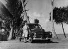 Driver, Josie McGovern poses with the Commanding Officer's Ford Car at Suva Point, Fiji. Image kindly provided by the Air Force Museum of New Zealand. CC BY NC 3.0