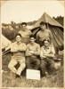 Five New Zealand Support Company soldiers pose for the camera in front of a supply tent at a military training camp, Japan. Left to right back: R. Hill, J.A. McConaghty. Left to right front: J.A. Johansen, D.J. Barnes, S.R.L. Pope. A sign resting on the legs of D. Barnes reads 'Out of Bounds to all ranks.' J.A. Johansen's photograph album of peacekeeping in Japan by the New Zealand Support Company, 22nd Battalion.  Please acknowledge Auckland Libraries Heritage Collections TRS-A01-32-03