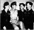 'NEW ZEALANDERS ABROAD.—Three flying sergeants from Christchurch undergoing air training at an American school were entertained recently in New Orleans by the Public Relations officer attached to the New Orleans army air base. LEFT TO RIGHT: Ray Sanderson, American official, Ray Leslie, and Joseph Bettle.' The Press, 10 August 1942.