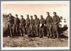 A group of New Zealand Soldiers engaged in clearing abandoned airfields, from Left to Right: J. Corbett (Gore), F. Fenton D.C.M (Auckland), D. Cundy (Wellington), Lieut. R.A. Pickmere (Auckland), M. Vincent (Auckland), R. Hume (Wellington), S. Lewis (Wellington), J. Smith (Wellington), R.S. Evans (Lower Hutt). Image kindly provided by Margaret Pickmere (March 2021).