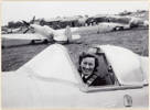 Judy Howden in the cockpit of a Spitfire at RAF Brize Norton, Oxfordshire, July 1945.  Auckland Libraries Heritage Collections Footprints 06436.