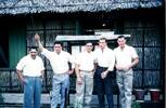 Five men in civies standing outside barracks. E. J. G. Ormsby, R. Gardiner, J. Walker-Grace, J. Richardson, A. McCutcheon. Image taken during Malayan Emergency 1959-1960. © Peter Gallacher.