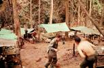 10 Pl "D" Coy. first camp after surrender of Kerinching, Senogit, Regek. Feb 1960. Bill Brown running up the hill. Image taken during Malayan Emergency 1959-1960. © Peter Gallacher.