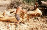 E. J. G. Ormsby and Bill Brown cutting tree trunk. Image taken during Malayan Emergency 1959-1960. © Peter Gallacher.