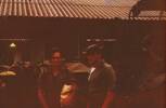 Two soldiers standing outside barracks. Richardson on right. Image taken during Malayan Emergency 1959-1960. © Peter Gallacher.