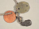 Close up of Dogtags and Hei Tiki belonging to Albert Dwyer Fletcher. Image kindly provided by Christine Tyler (May 2021).