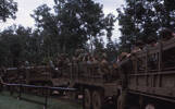 Centre truck includes Roy Reddy. Image taken by Lance Corporal Te Hira Wati Heremaia (38481) during active service in the Vietnam War c.1960s. Part of a collection of 150 slides kindly provided by whānau for scanning. © Heremia Whānau  (Heremaia-VTM085).