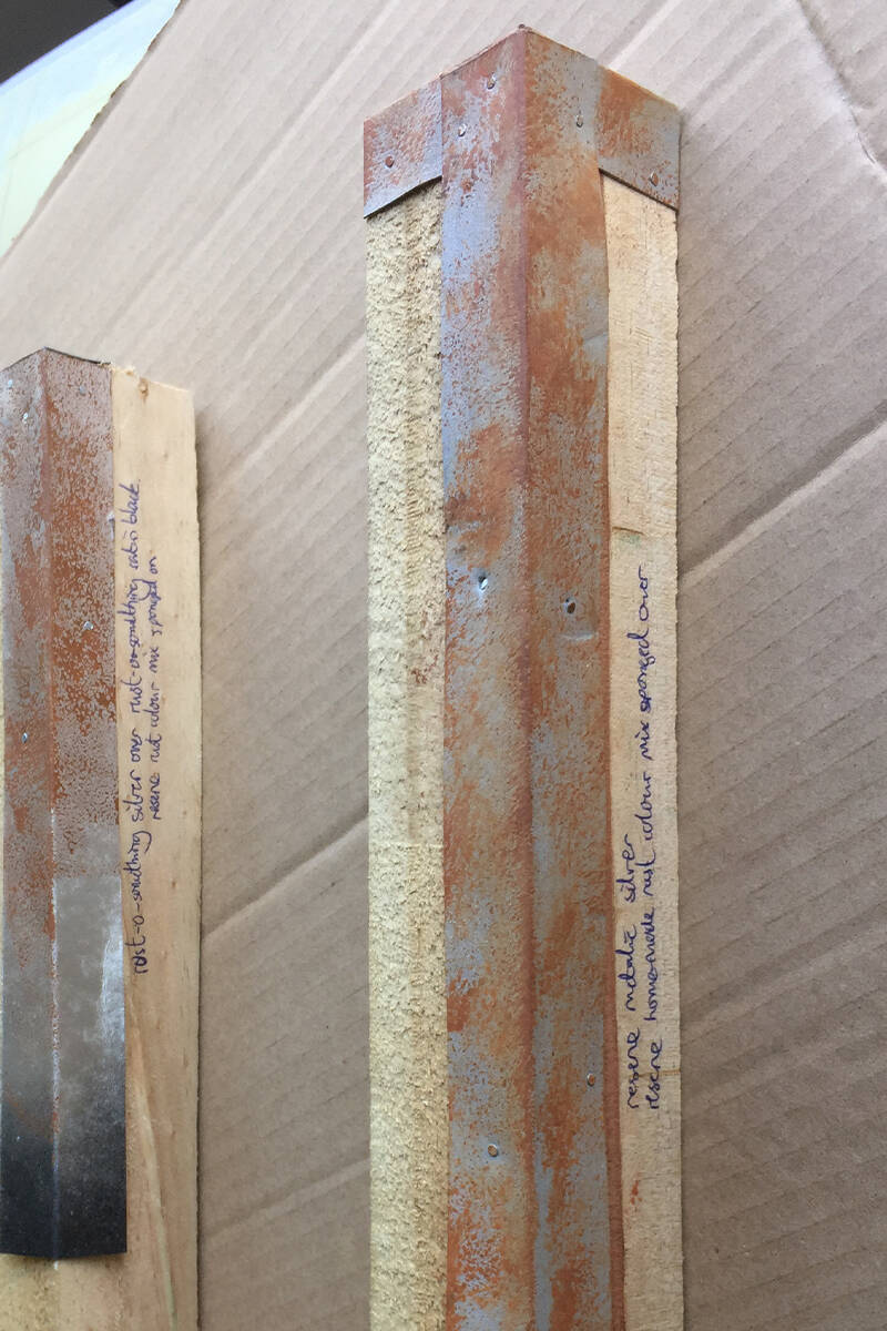 Testing different paint combinations to look like rusted edges on the tea-chests.