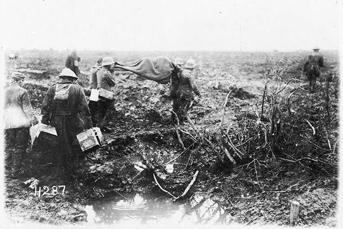 Prisoners bringing in wounded