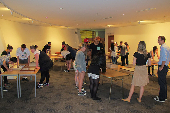 Students examine objects